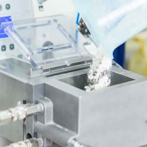 carefully measuring ingredients